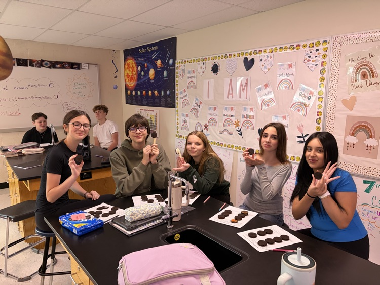 8th students having fun with the Oreo Eclipse project in Mrs. Blaesser's class.