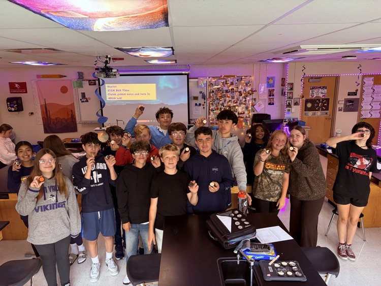 8th students having fun with the Oreo Eclipse project in Mrs. Blaesser's class.