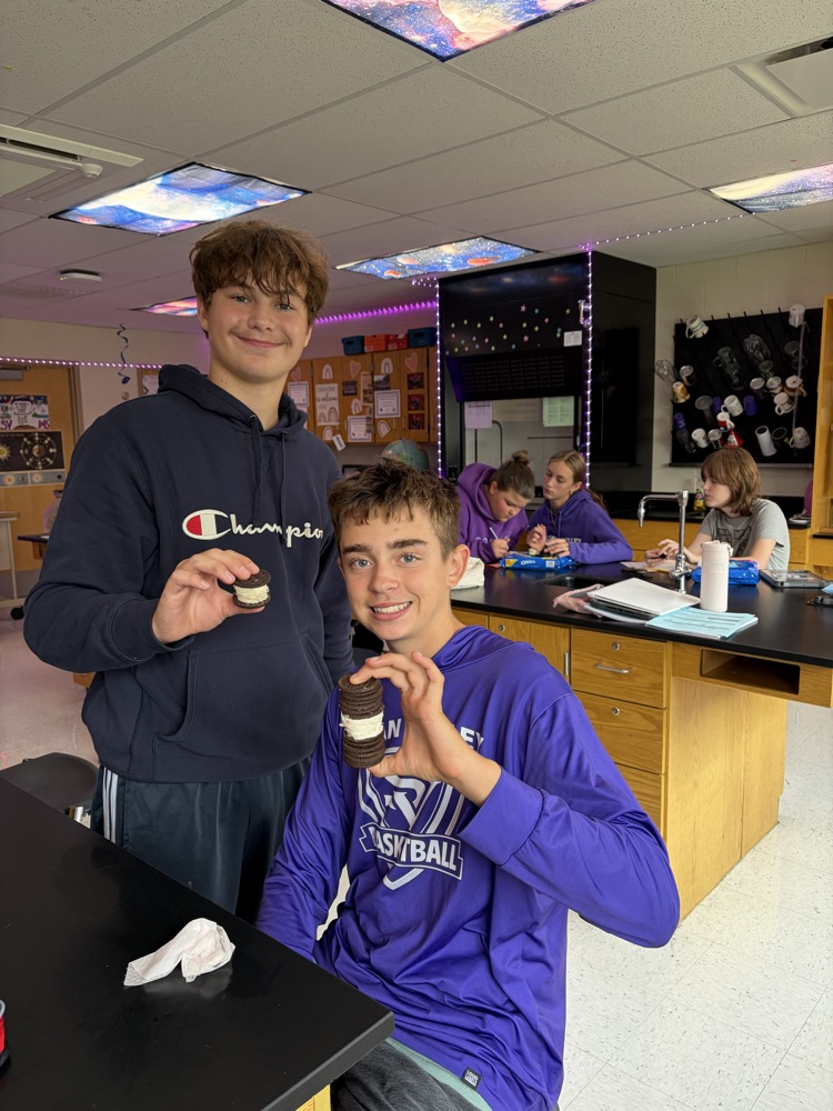 8th students having fun with the Oreo Eclipse project in Mrs. Blaesser's class.