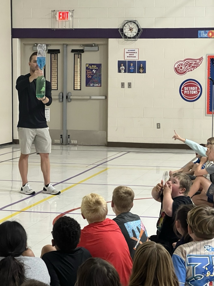 Chris Easlick, Chief Meteorologist from WNEM-TV 5 models a tornado in a bottle.