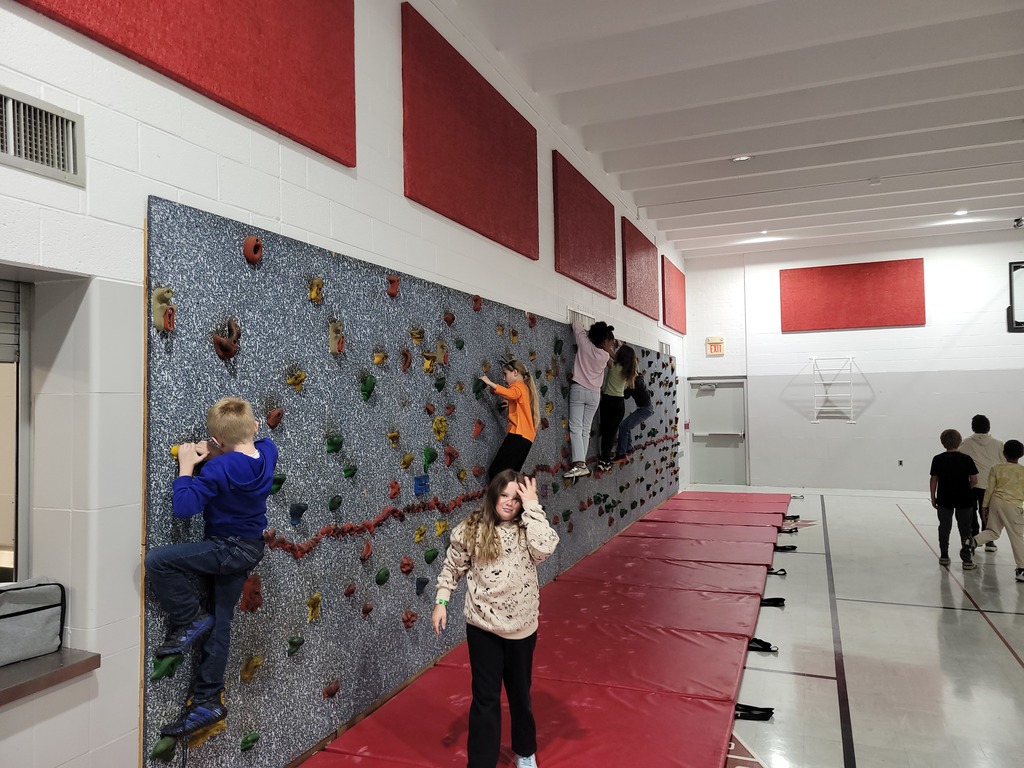 Rock climbing  during gym class.