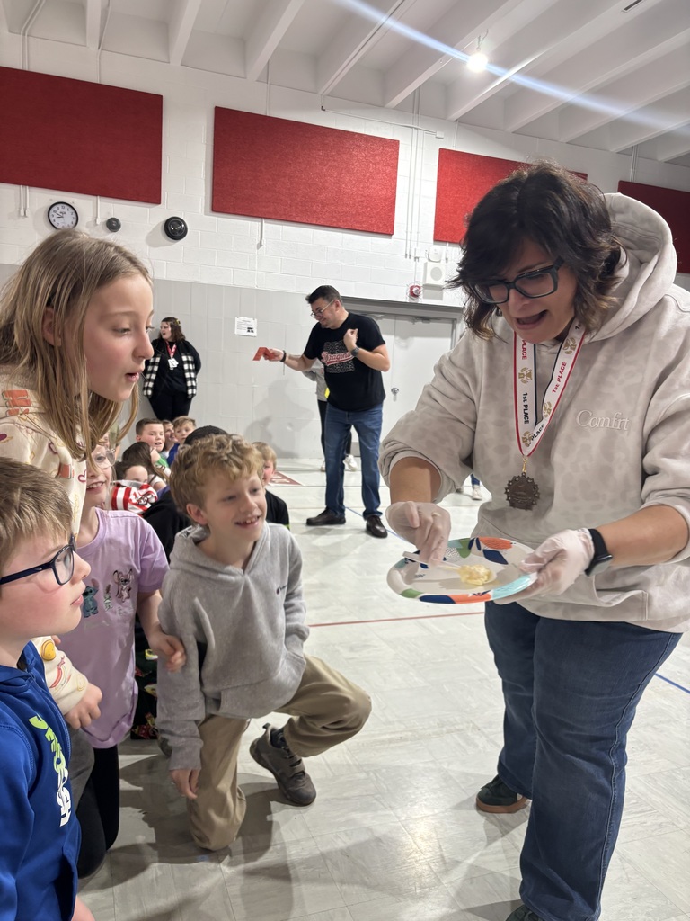 Mrs. Wiles showing her third graders what Mr. West will have to eat.