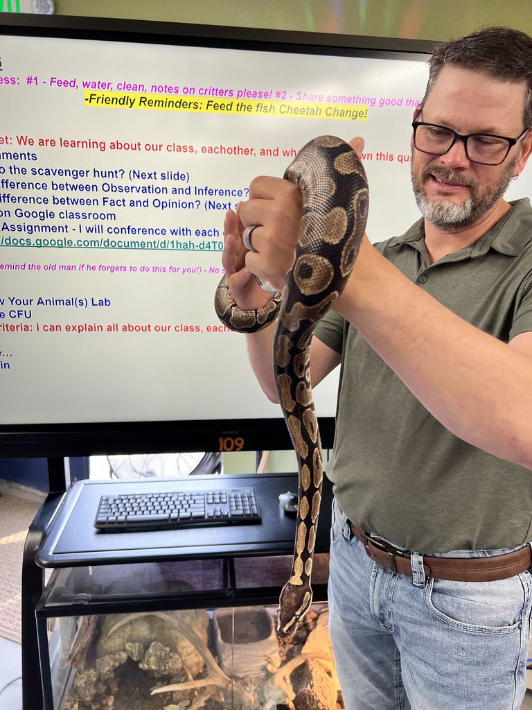 Mr Parson holding python snake