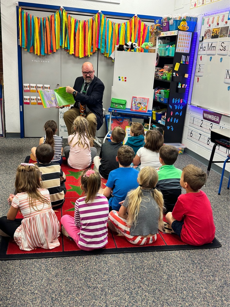 Dr. Cooper reading to class