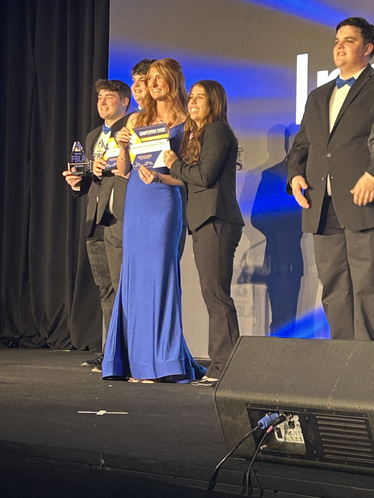 student receiving reward for real estate exam