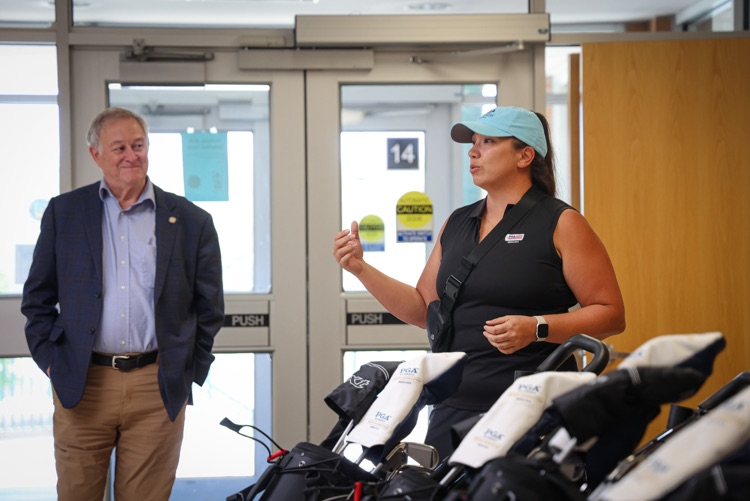 club director talking with the athletes about the program
