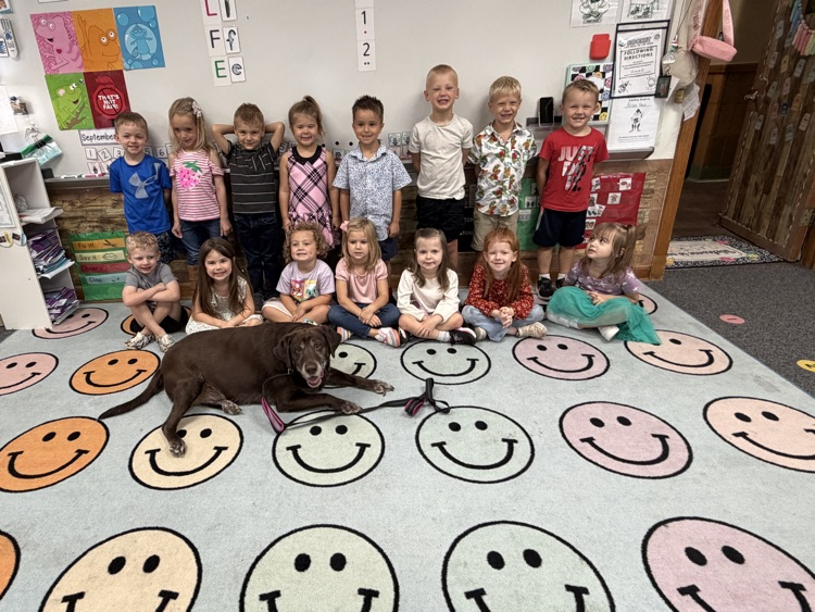 class photo with dog 
