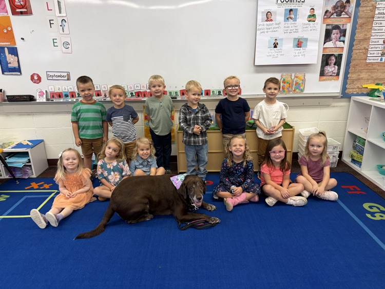 class photo with dog 