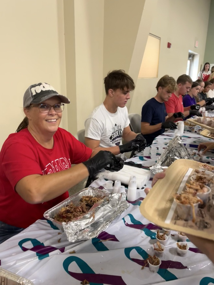 Helping serve the pulled pork
