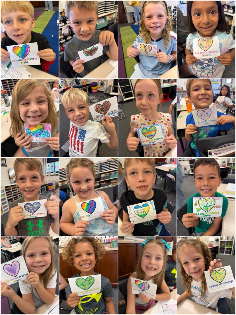 students holding hearts with trusted adult 