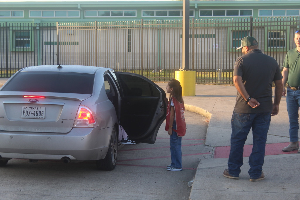 Manuel Banda and Greg Benedict help with drop off at Petty