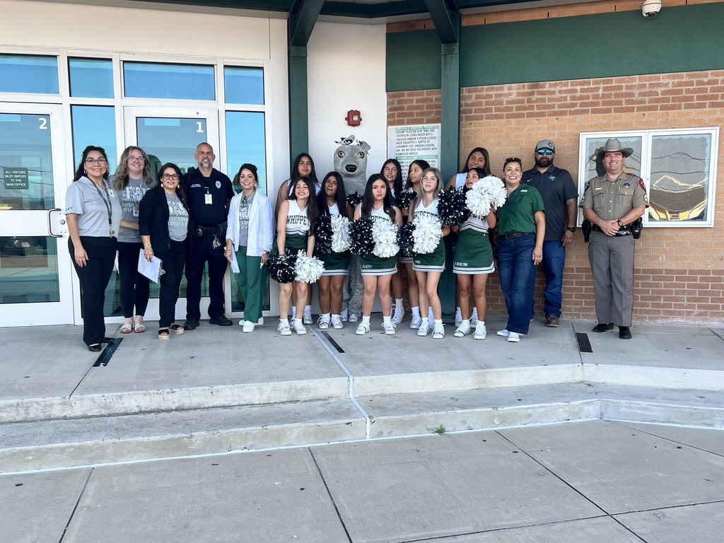 Group Photo of Board and cheerleaders at Trevino Jr High