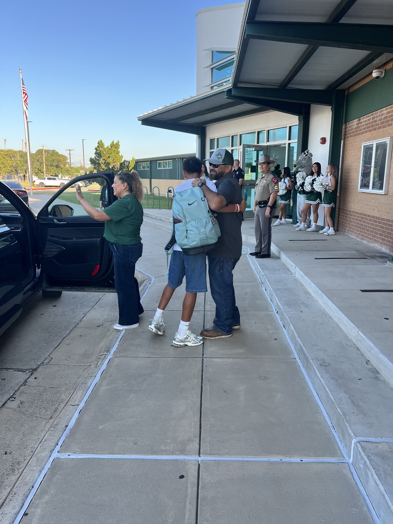 Garza and Banda assist with drop off at Jr High