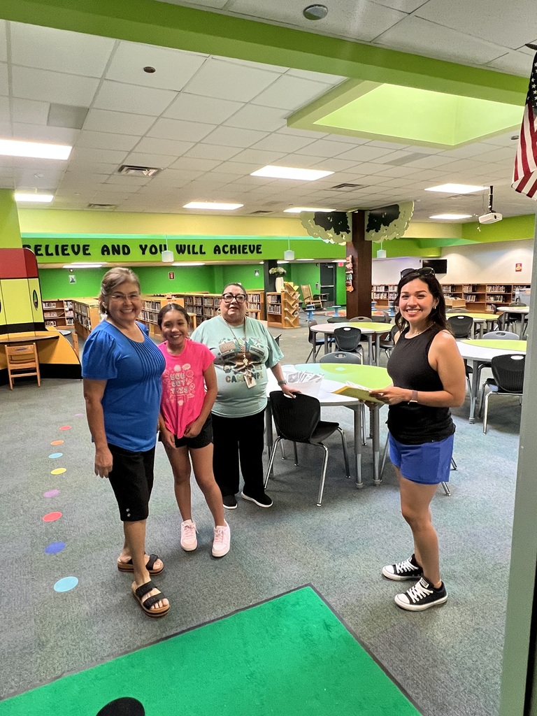 Patsy Alvarado and granddaughter visit library at Petty Meet the Teacher