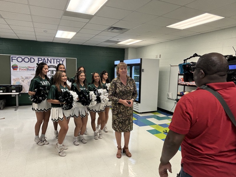 Dr. Irene Garza with Cheerleaders