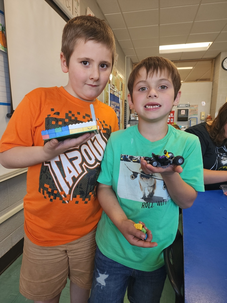 Children holding Legos