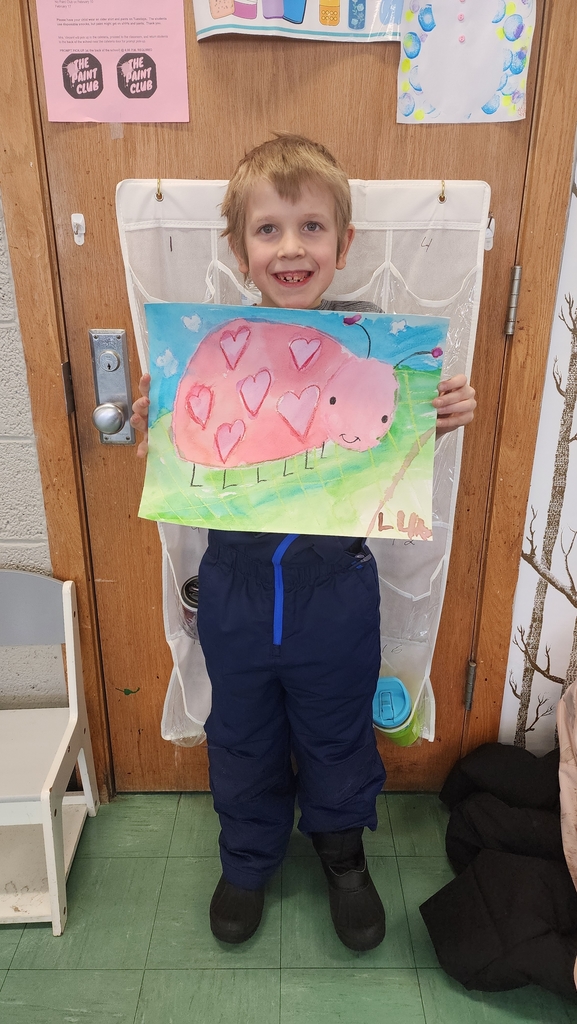 Students holding painting