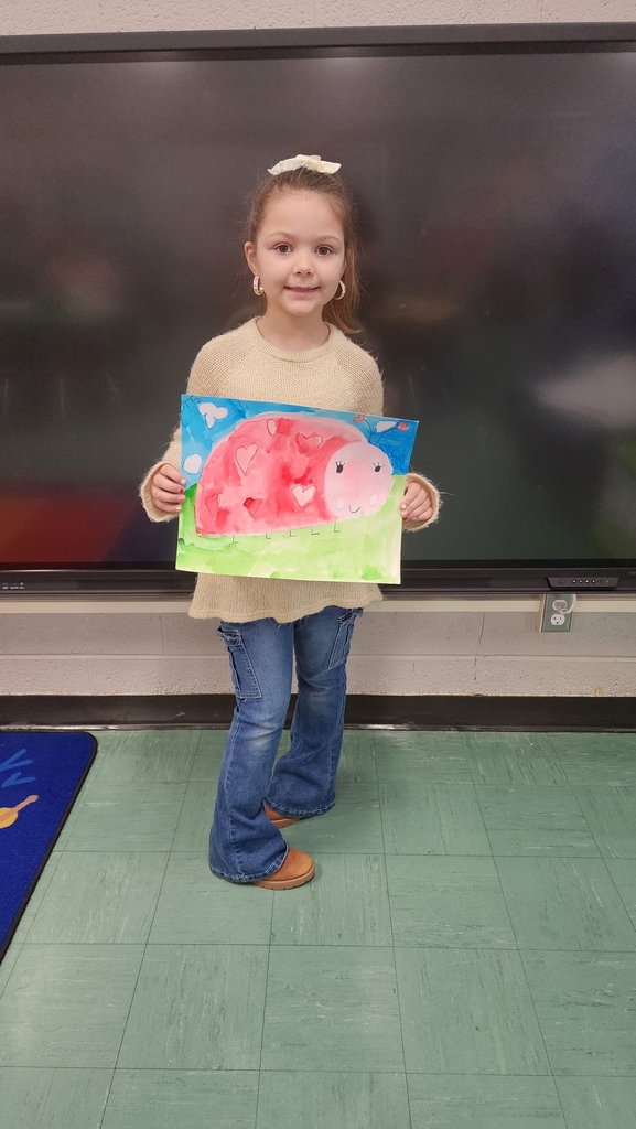 Students holding painting