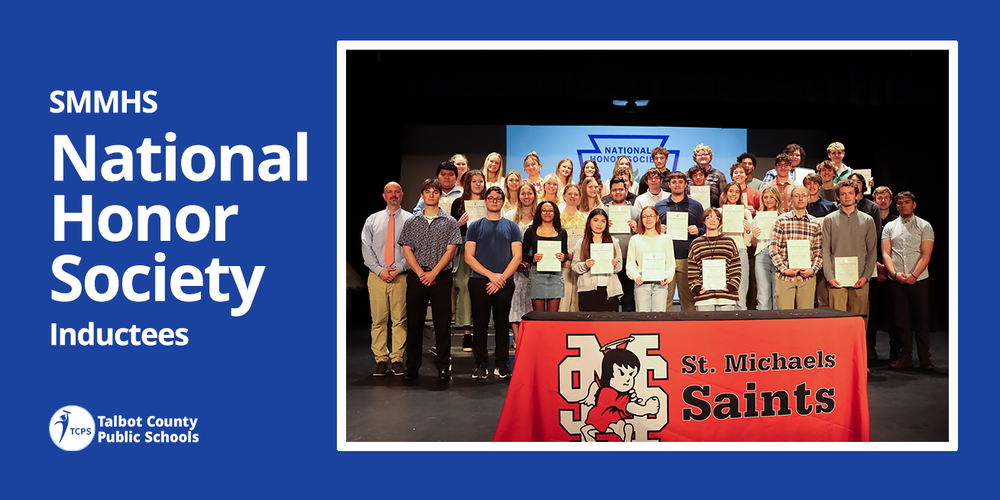a group of students admitted to the SMMHS NHS standing on a sttage