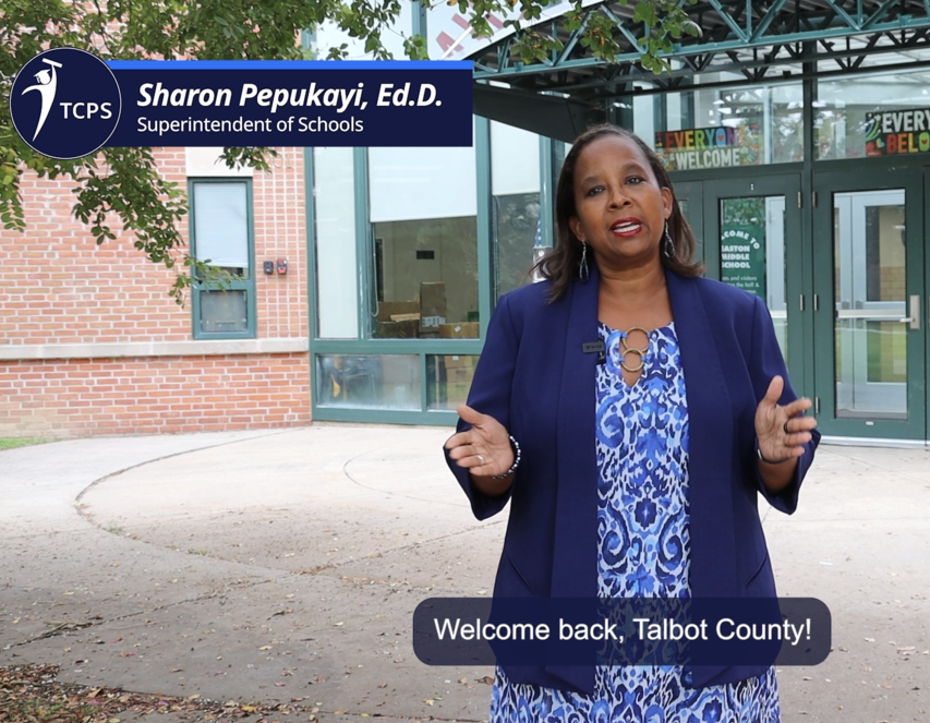 Dr. Pepukayi standing outside Easton Middle recording her "Welcome Back" video for the 2025-2026 school year