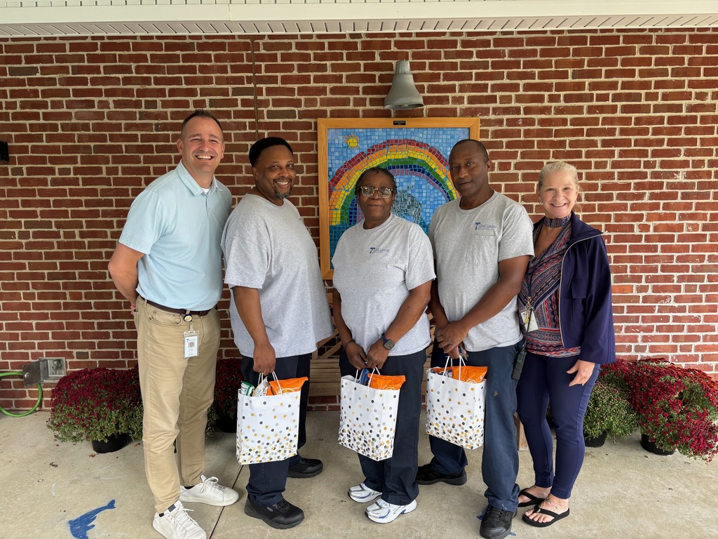 caucasian male Principal, African American male, female and male custodians, caucasian female Office Manager.