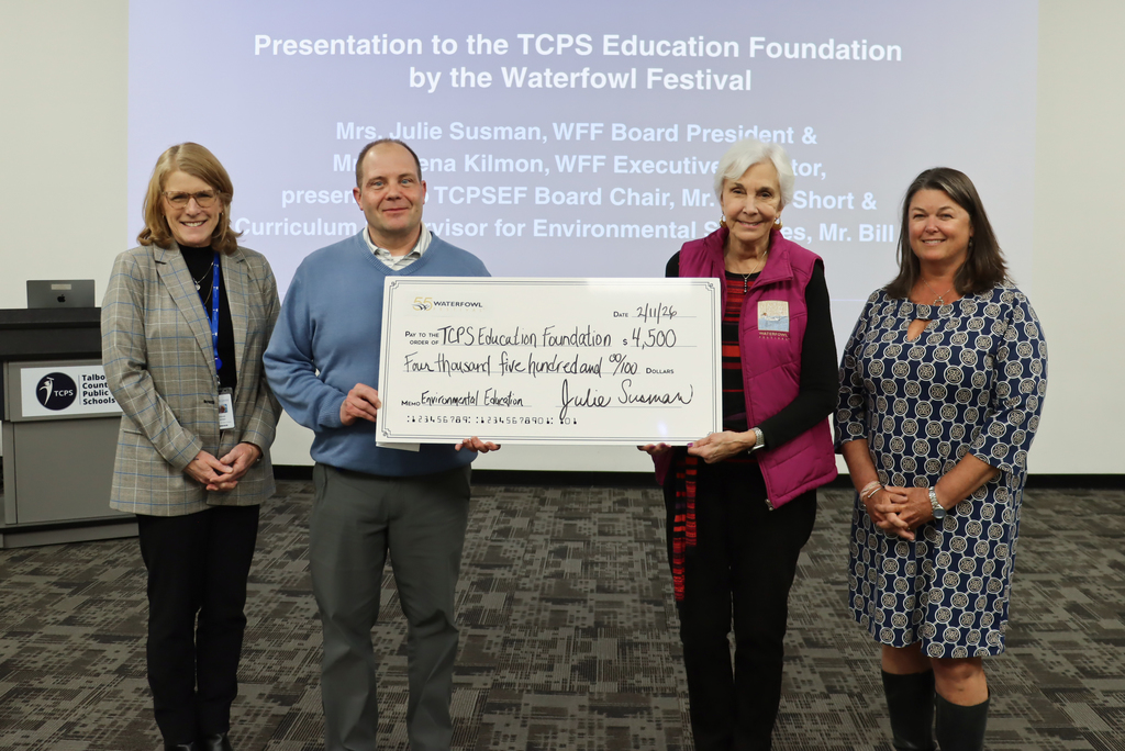 The Waterfowl Festival presents a check to the TCPS Education Foundation at the February Board of Education Meeting