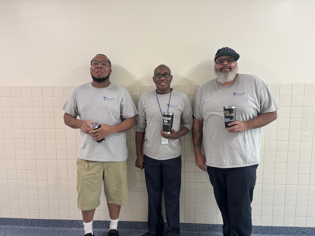 Custodians posing with swag