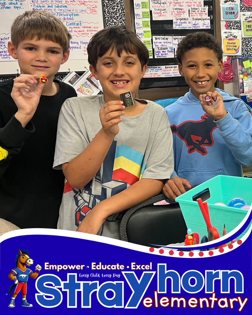 Students holding toys