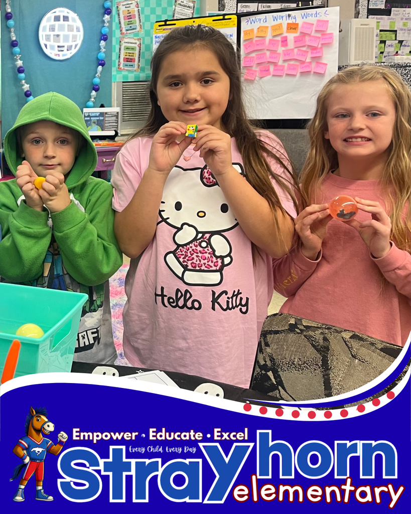 Students holding toys