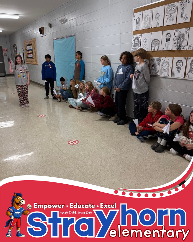 students in hallway with paper airplanes