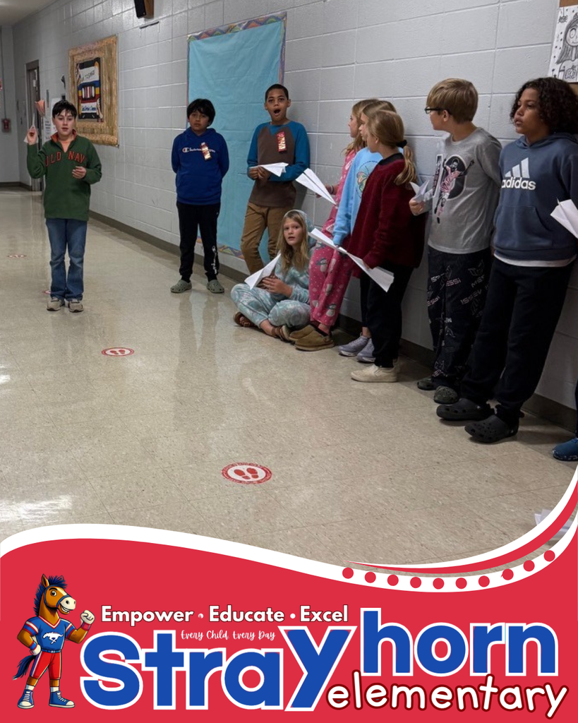 students in hallway with paper airplanes