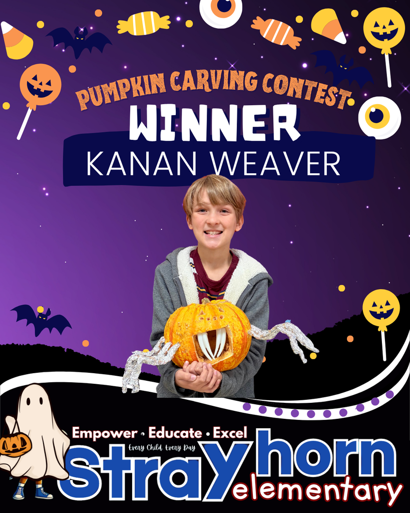 student smiling at camera holding a carved pumpkin