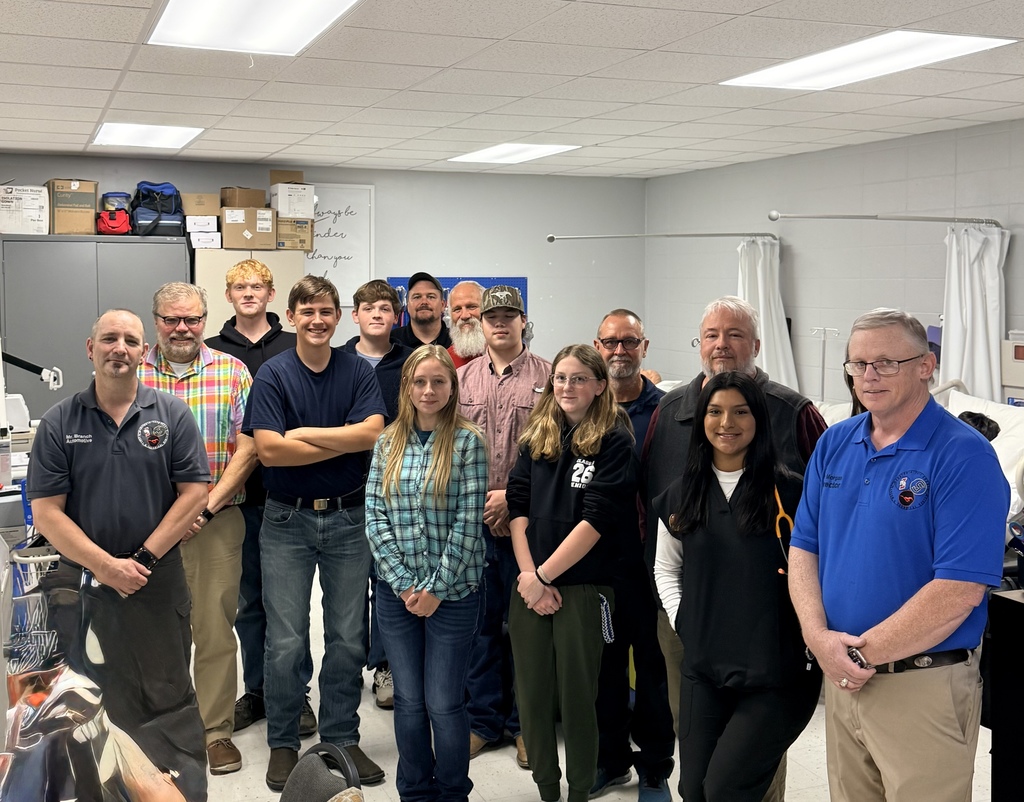 students being recognized at the board meeting