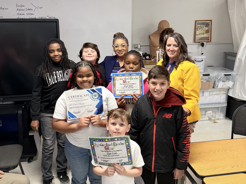 students being recognized at the board meeting