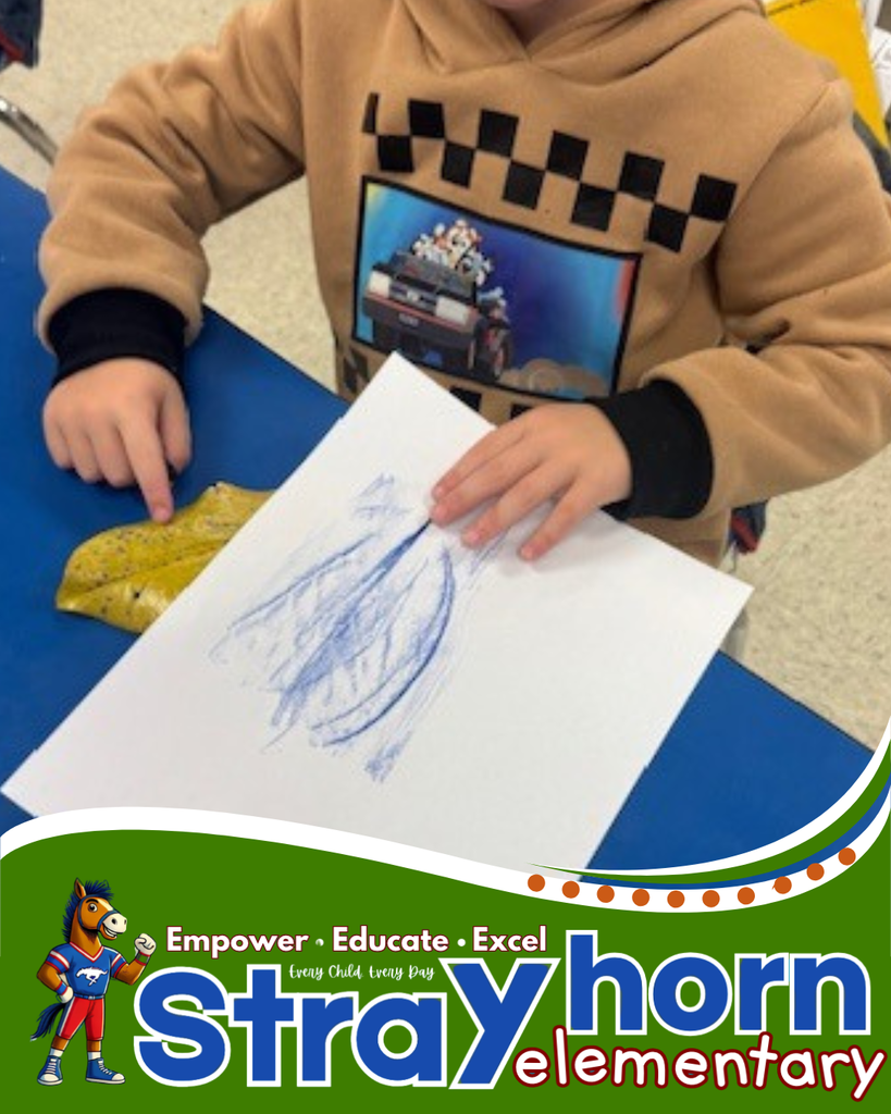 student coloring on paper