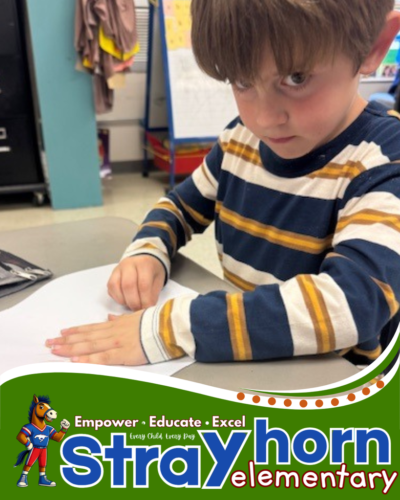 student coloring on paper