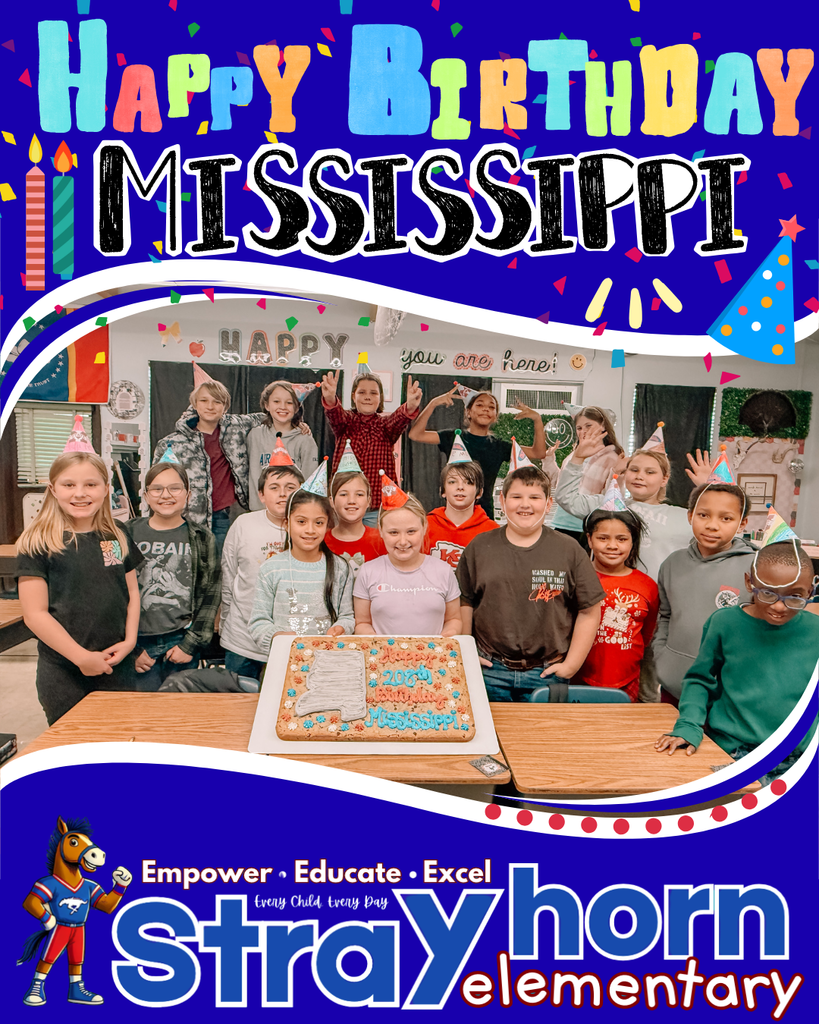 students smiling at camera holding cookie cake