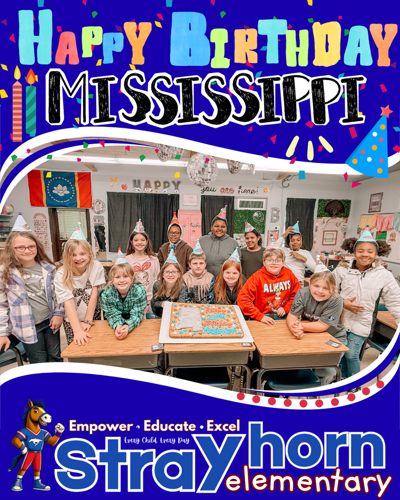 students smiling at camera holding cookie cake