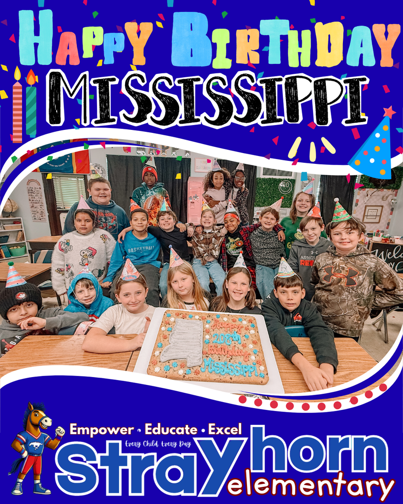 students smiling at camera holding cookie cake