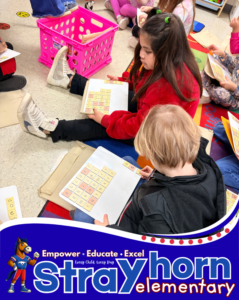 2 students with letter tiles