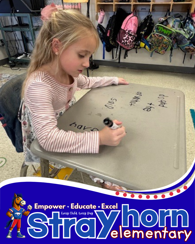 student writing on desk