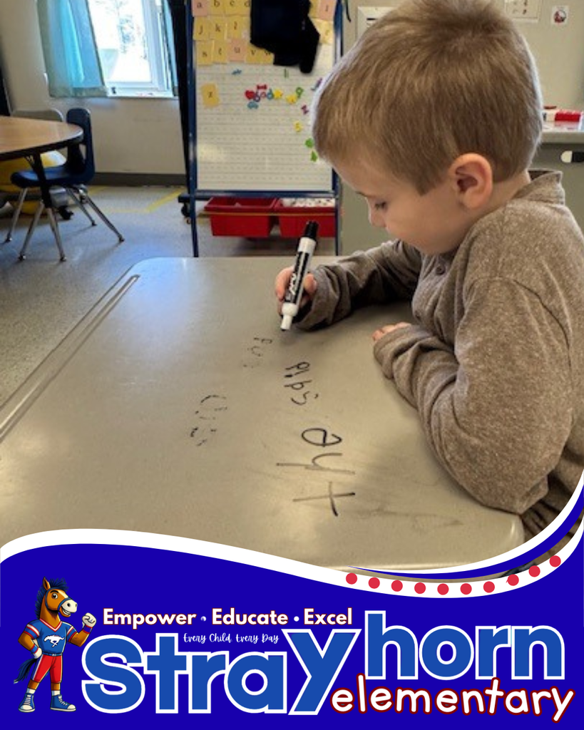 student writing on desk