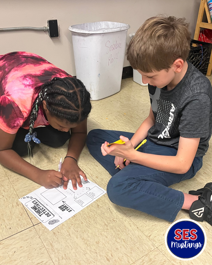 students writing in groups