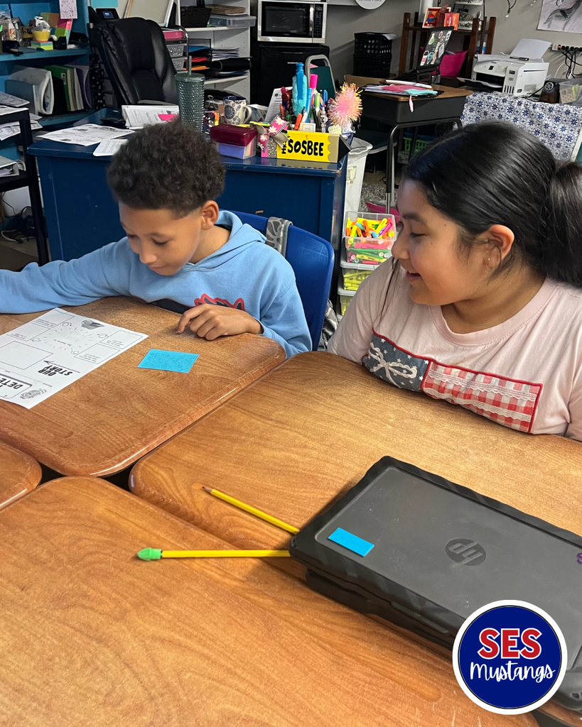 students writing in groups