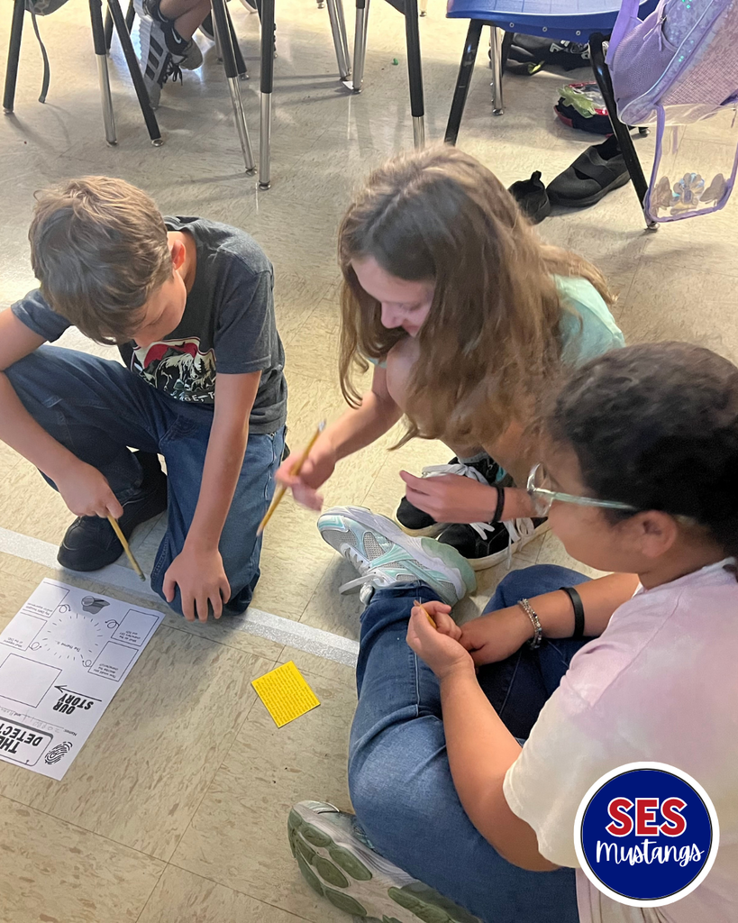 students writing in groups
