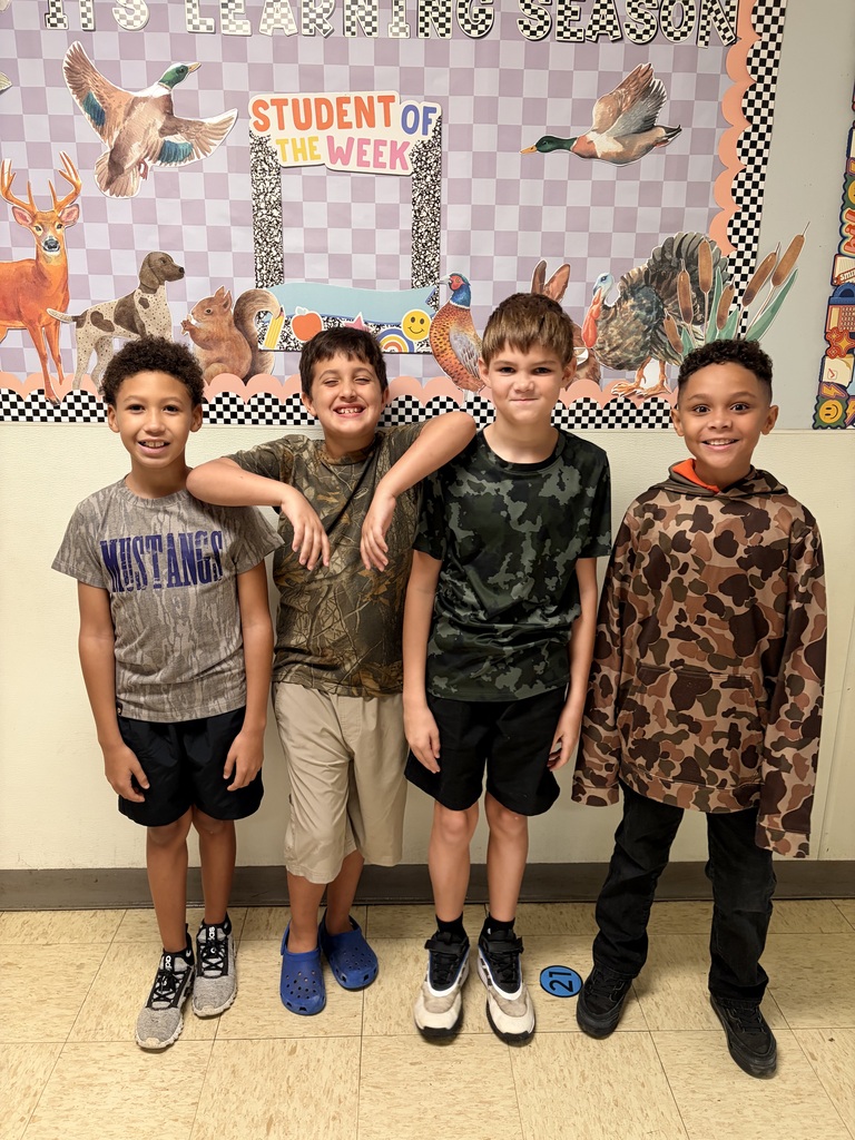 people smiling at the camera wearing camo