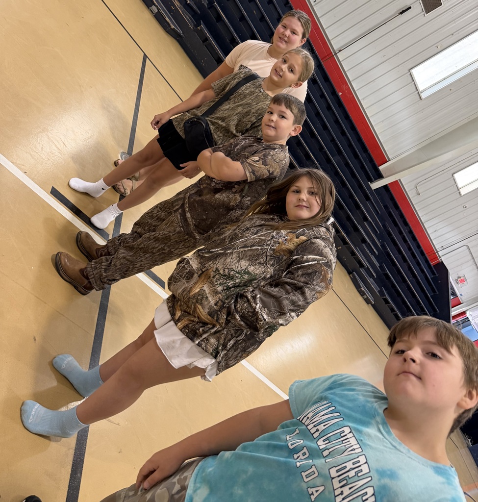 people smiling at the camera wearing camo
