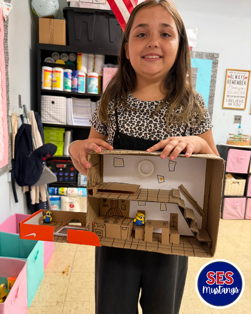 girl with cardboard house