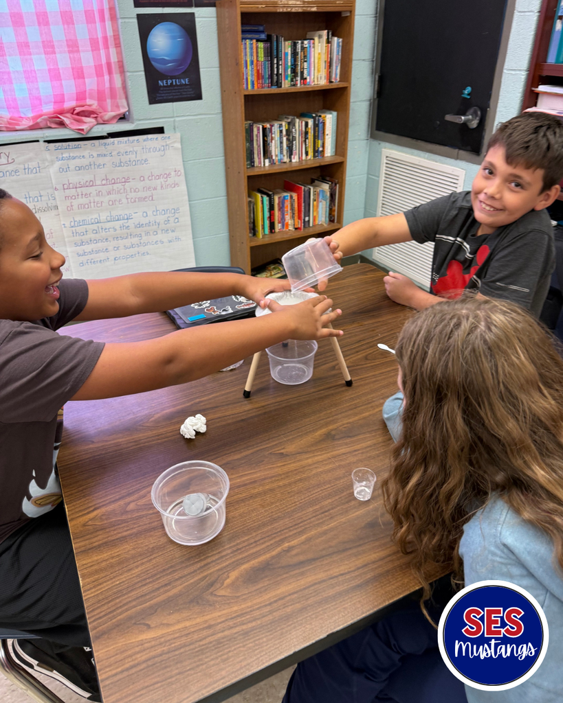 students working in groups with science equipment