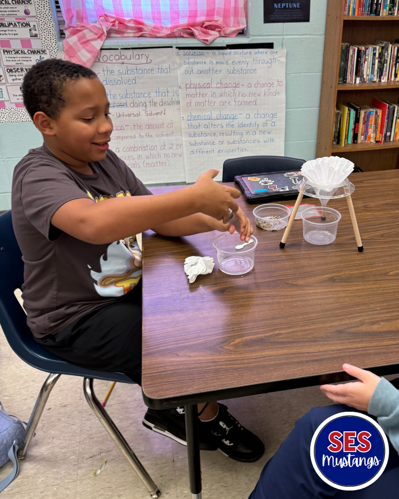 students working in groups with science equipment